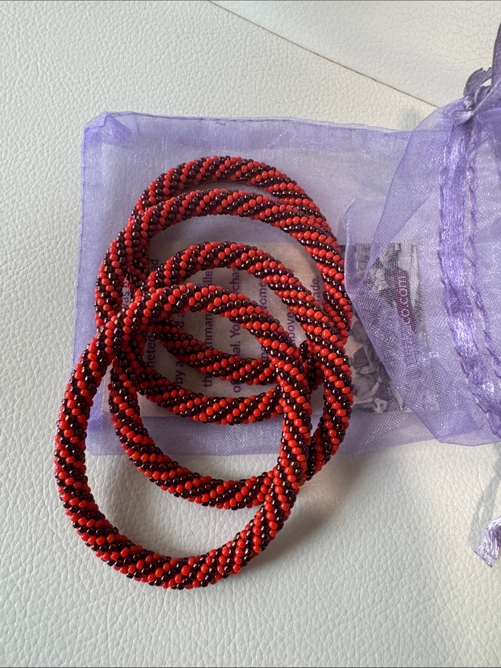 4 Orange + iridescent purple Sashka Co Beaded Spiral Bracelets - Clemson